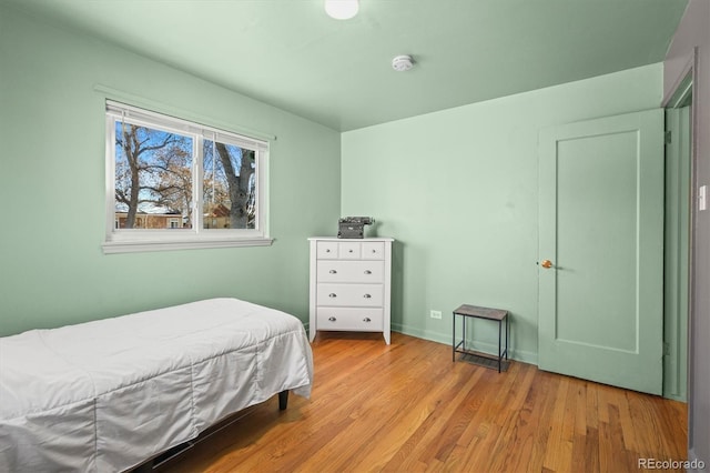 bedroom with light hardwood / wood-style floors