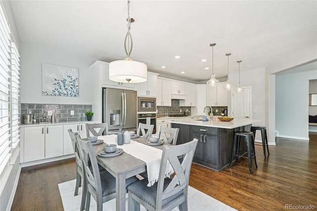 17020 E 107th Ave, Commerce City, CO 80022 - dining room featuring dark wood-style flooring and recessed lighting