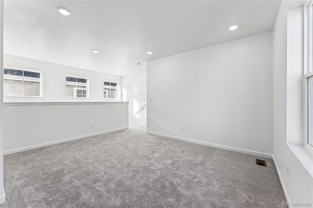 3295 N Coolidge Way, Aurora, CO 80019 - spare room with carpet flooring, recessed lighting, baseboards, and a textured ceiling