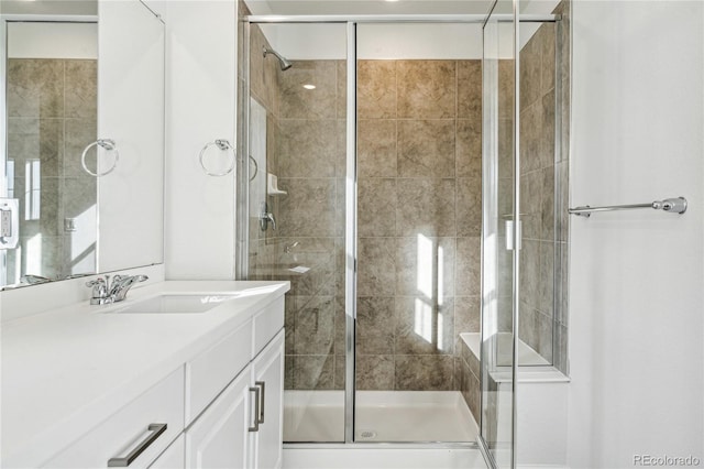 3295 N Coolidge Way, Aurora, CO 80019 - bathroom with vanity and a shower stall