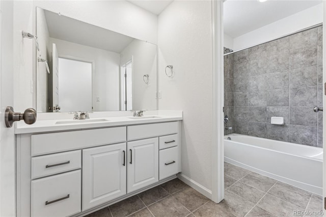 3295 N Coolidge Way, Aurora, CO 80019 - full bath with double vanity, shower / bathtub combination, tile patterned flooring, and baseboards