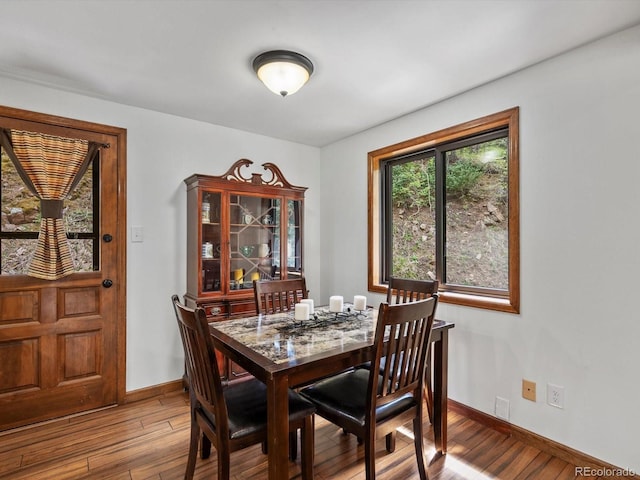 28272 Shadow Mountain Dr, Conifer, CO 80433 - dining room featuring light wood finished floors and baseboards