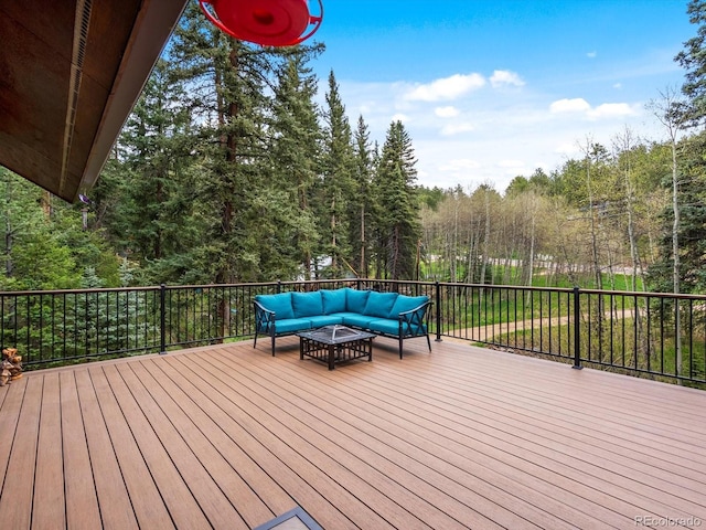 28272 Shadow Mountain Dr, Conifer, CO 80433 - wooden terrace with an outdoor living space and a forest view