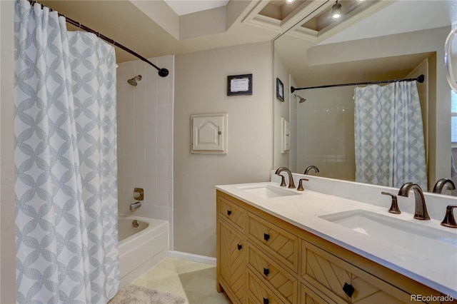 8043 S Zephyr St, Littleton, CO 80128 - bathroom featuring shower / bath combo with shower curtain, double vanity, and tile patterned flooring