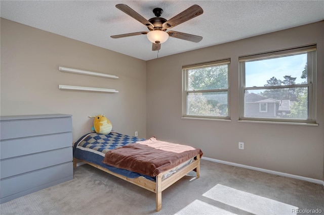 8043 S Zephyr St, Littleton, CO 80128 - bedroom featuring carpet, a textured ceiling, and a ceiling fan