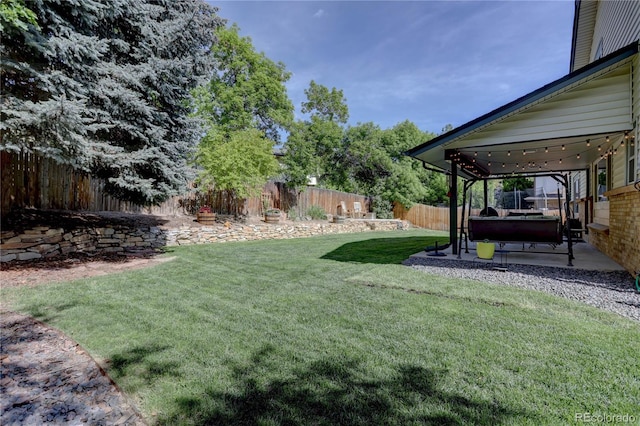 8043 S Zephyr St, Littleton, CO 80128 - fenced backyard with a patio area