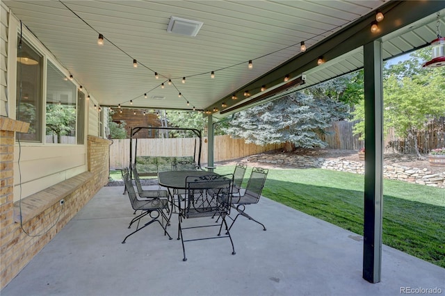 8043 S Zephyr St, Littleton, CO 80128 - fenced backyard featuring a patio area and outdoor dining space
