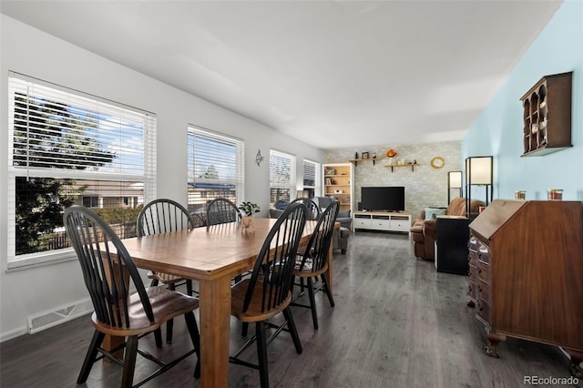 dining room with visible vents, dark wood finished floors, and baseboards