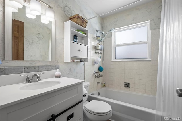 bathroom with shower / bath combo, vanity, and toilet