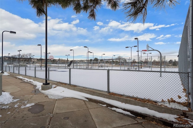 view of basketball court featuring community basketball court and fence