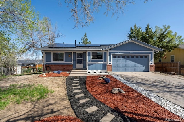 16933 E Bethany Pl, Aurora, CO 80013 - ranch-style home featuring fence, brick siding, roof mounted solar panels, and a garage