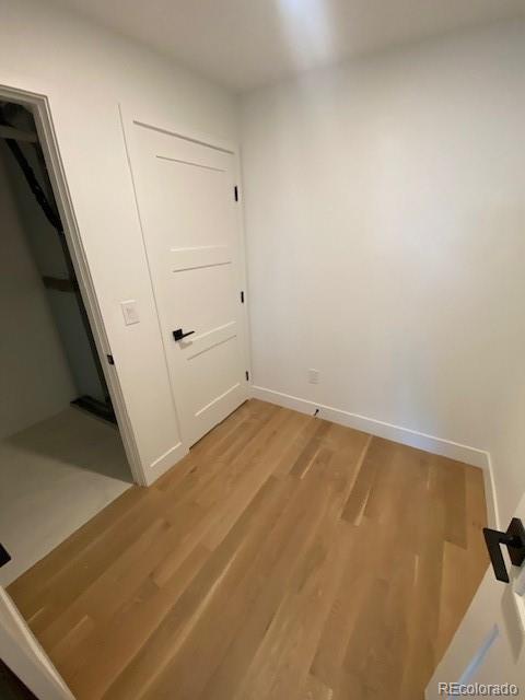 unfurnished room with light hardwood / wood-style flooring