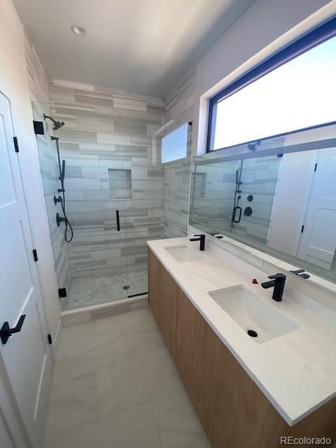 bathroom with vanity and an enclosed shower