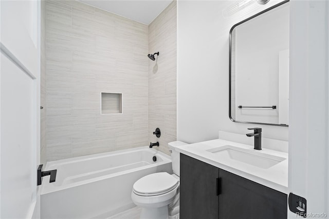 bathroom with shower / bath combination, vanity, and toilet