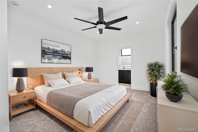 bedroom featuring ensuite bathroom, baseboards, carpet flooring, and recessed lighting