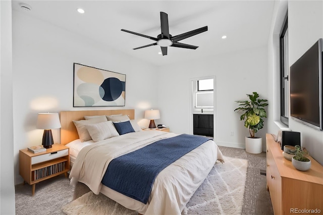 bedroom with light carpet, baseboards, connected bathroom, and recessed lighting