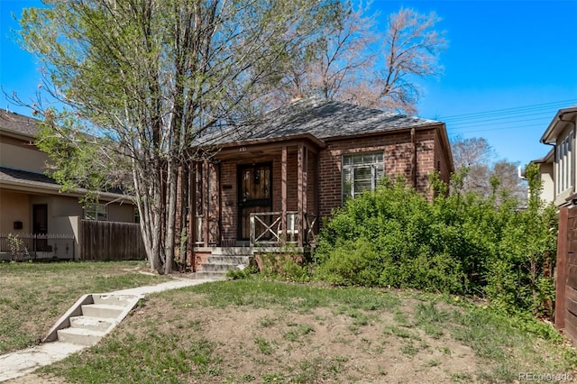 451 Harrison St, Denver, CO 80206 - view of front of house featuring brick siding and covered porch