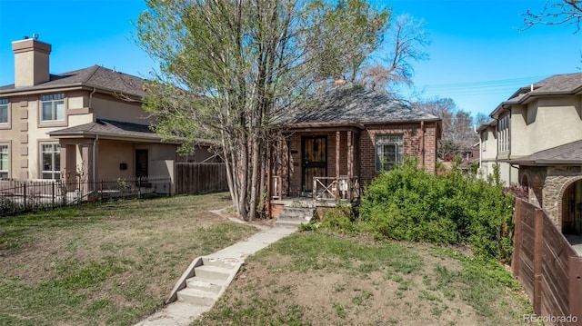 451 Harrison St, Denver, CO 80206 - view of front of property with a chimney and a porch