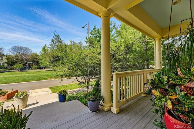 8256 E 28th Dr, Denver, CO 80238 - deck featuring a yard and a porch