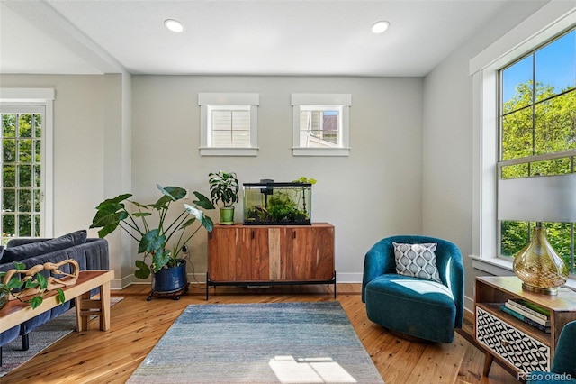 8256 E 28th Dr, Denver, CO 80238 - sitting room with plenty of natural light, recessed lighting, and hardwood / wood-style flooring