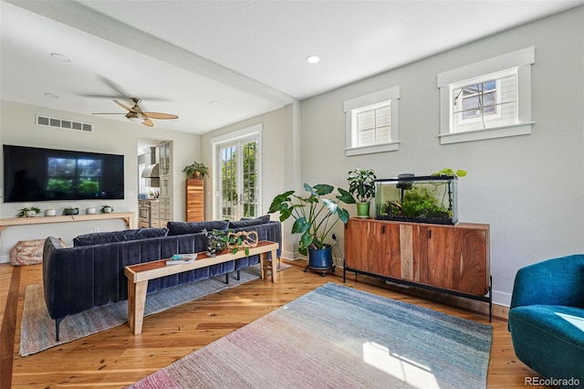 8256 E 28th Dr, Denver, CO 80238 - living area with ceiling fan, wood finished floors, recessed lighting, and baseboards