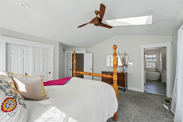 8256 E 28th Dr, Denver, CO 80238 - bedroom featuring a skylight, lofted ceiling, carpet flooring, a closet, and ceiling fan