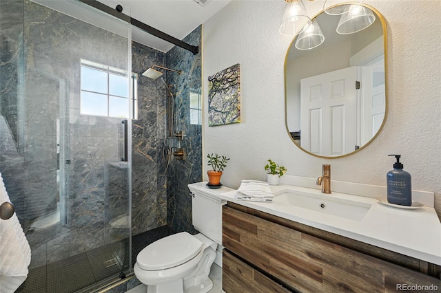 8256 E 28th Dr, Denver, CO 80238 - full bath with toilet, a marble finish shower, a textured wall, and vanity
