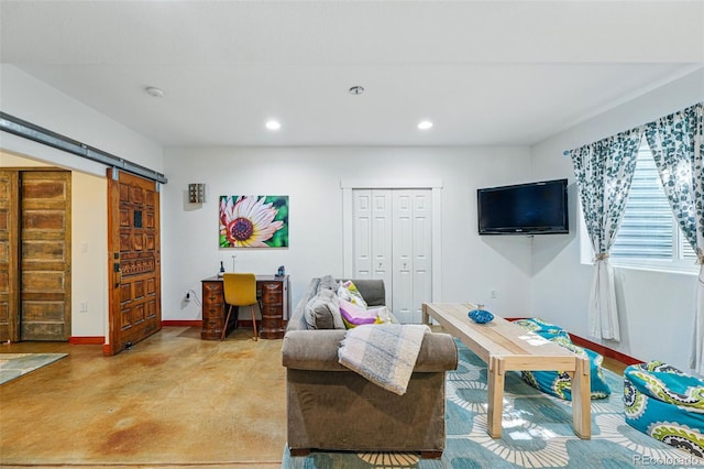 8256 E 28th Dr, Denver, CO 80238 - living area with concrete flooring, recessed lighting, and baseboards