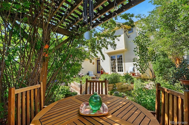 8256 E 28th Dr, Denver, CO 80238 - deck with outdoor dining space and a pergola