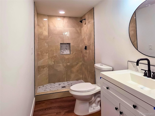 9193 US Highway 36, Joes, CO 80822 - full bathroom featuring wood finished floors, vanity, and a tile shower