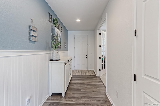9835 Uravan St, Commerce City, CO 80022 - hall featuring dark wood-style floors and wainscoting