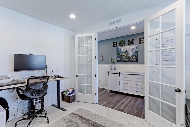 9835 Uravan St, Commerce City, CO 80022 - office area with french doors, recessed lighting, a wainscoted wall, and wood finished floors