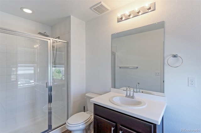 9835 Uravan St, Commerce City, CO 80022 - full bath with a stall shower, toilet, and vanity