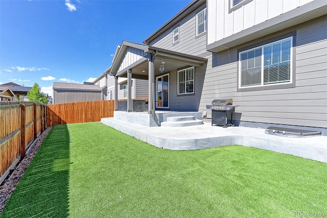 9835 Uravan St, Commerce City, CO 80022 - back of property featuring board and batten siding and a patio