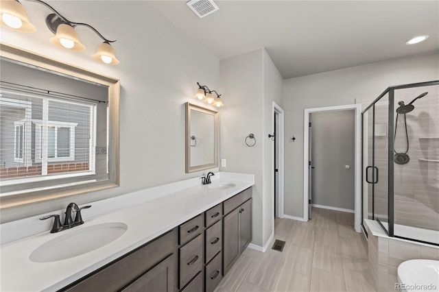 bathroom featuring vanity and walk in shower