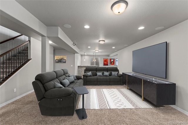 carpeted living room with a textured ceiling