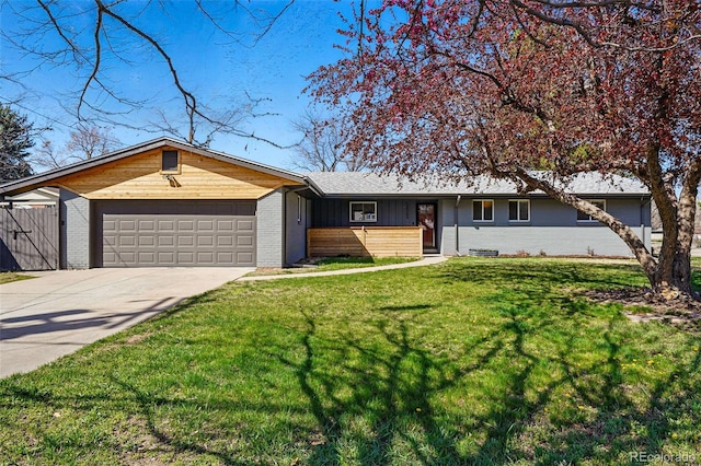 12345 W 32nd Ave, Wheat Ridge, CO 80033 - single story home featuring concrete driveway, board and batten siding, a front lawn, brick siding, and a garage