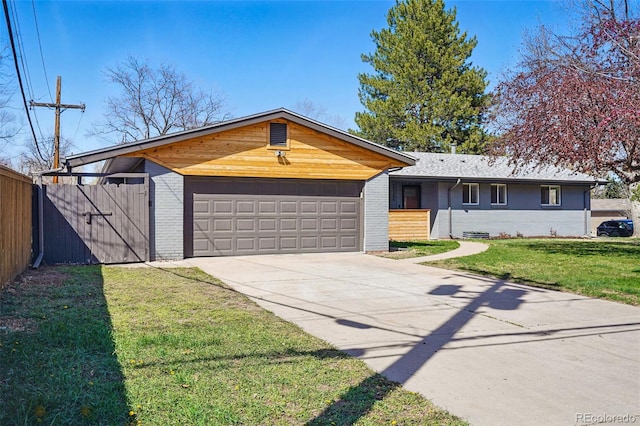 12345 W 32nd Ave, Wheat Ridge, CO 80033 - ranch-style home featuring brick siding, a front yard, fence, and driveway