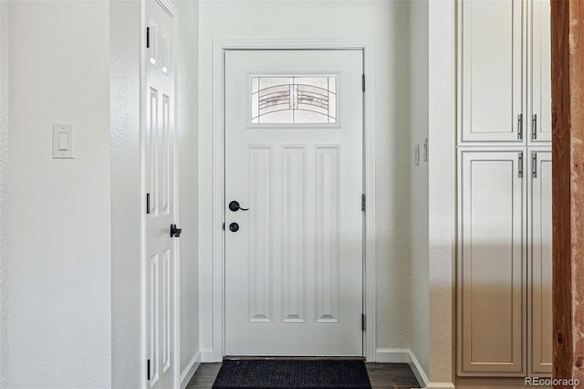 12345 W 32nd Ave, Wheat Ridge, CO 80033 - doorway featuring dark wood-style floors and baseboards