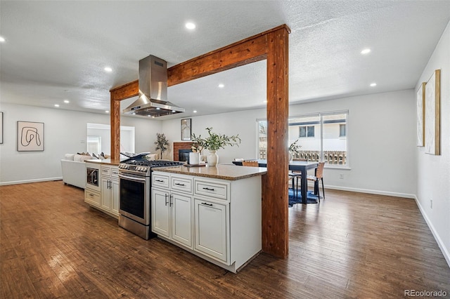 12345 W 32nd Ave, Wheat Ridge, CO 80033 - kitchen with island range hood, open floor plan, appliances with stainless steel finishes, and dark wood-type flooring