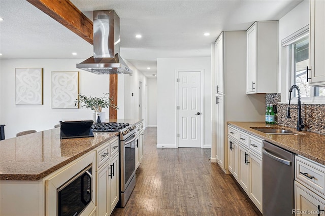 12345 W 32nd Ave, Wheat Ridge, CO 80033 - kitchen with stainless steel appliances, a sink, island exhaust hood, and dark stone counters