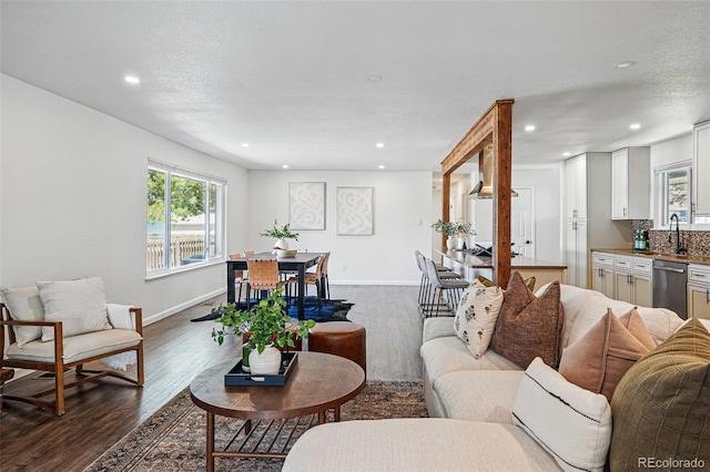 12345 W 32nd Ave, Wheat Ridge, CO 80033 - living area featuring baseboards, recessed lighting, and dark wood-style floors