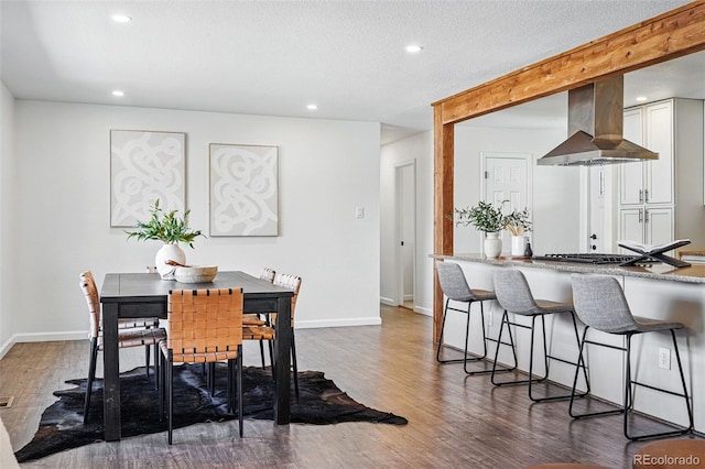 12345 W 32nd Ave, Wheat Ridge, CO 80033 - dining room with wood finished floors, baseboards, and recessed lighting