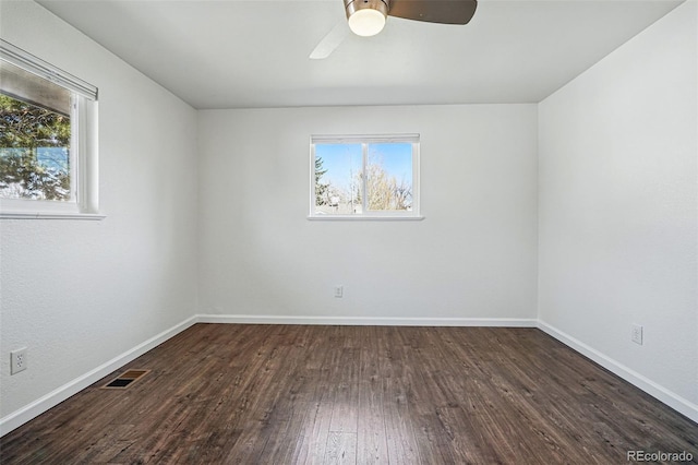 12345 W 32nd Ave, Wheat Ridge, CO 80033 - spare room featuring visible vents, ceiling fan, wood finished floors, and baseboards