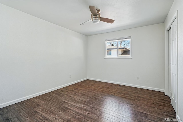 12345 W 32nd Ave, Wheat Ridge, CO 80033 - unfurnished bedroom with a closet, baseboards, visible vents, dark wood-style flooring, and ceiling fan