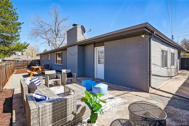 12345 W 32nd Ave, Wheat Ridge, CO 80033 - back of house with a patio area, a fenced backyard, and an outdoor hangout area