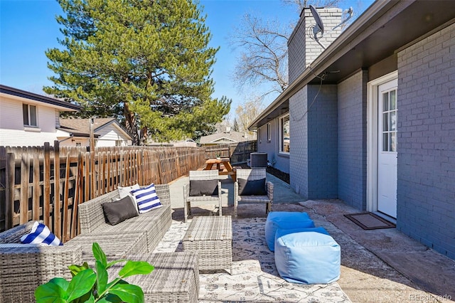 12345 W 32nd Ave, Wheat Ridge, CO 80033 - view of patio / terrace featuring an outdoor living space, fence private yard, and cooling unit