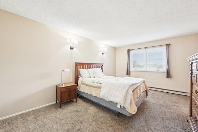 carpeted bedroom with baseboards, baseboard heating, and a textured ceiling