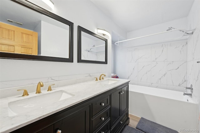 full bathroom featuring double vanity, tub / shower combination, visible vents, and a sink