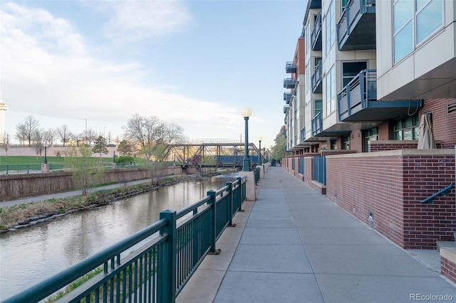 surrounding community featuring a water view